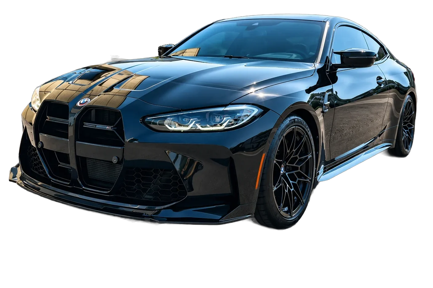 Black BMW M4 coupe with a fresh ceramic coating, gloss reflecting the sky