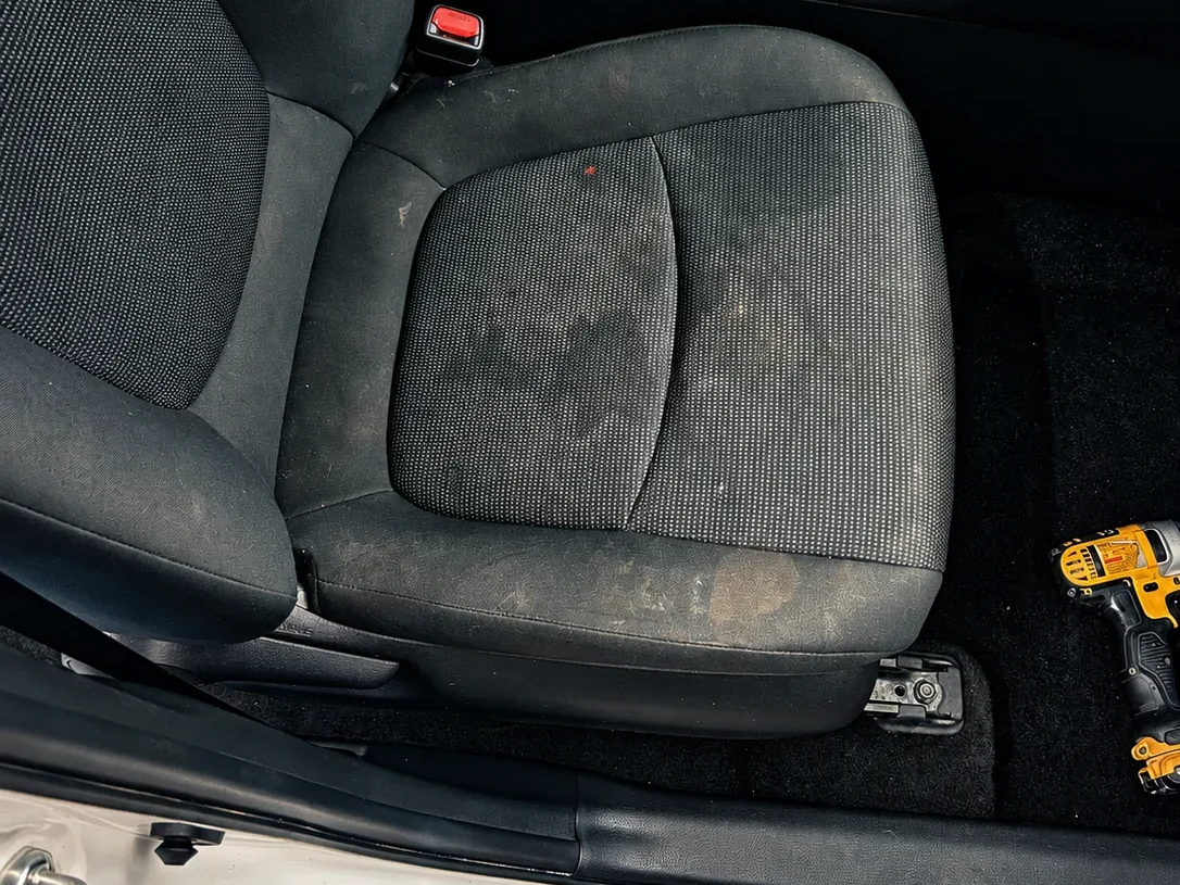 Seat before interior detail, stained and dirty